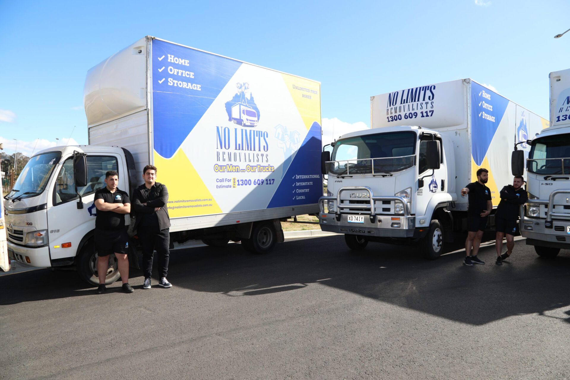 No Limits crew standing beside their trucks